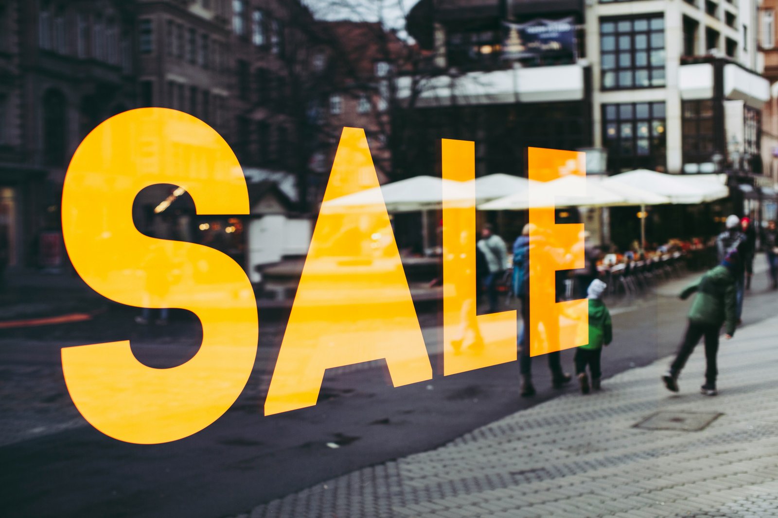 SALE sign on a general retail shop window
